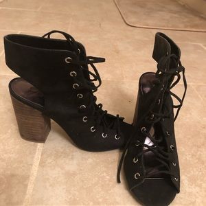 Cute black lace up heels. Only worn once. Suede